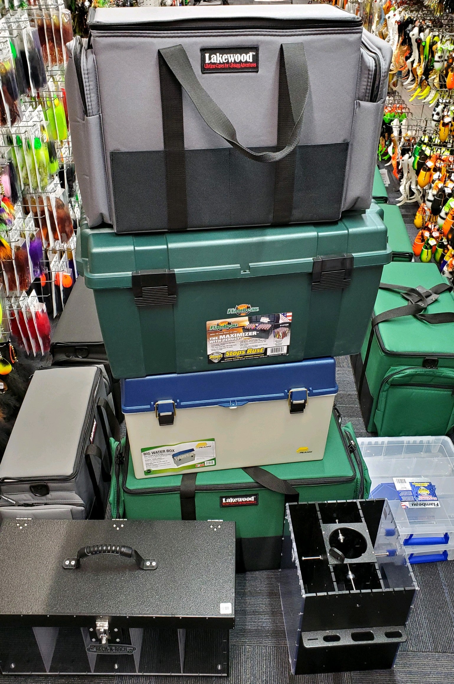 best box to hold muskie tackle Upright Medium Box A037 Holds up to 80 baits Four removable/adjustable and 4 solid hanging lure dividers Two Bucktail rails Zippered storage pockets on each end hold 3600 style Plano Stowaway storage boxes Zippered storage pockets on each side pocket for small item Four front Ballistic Tool storage pockets Large rear zippered pocket holds a 3700 style Plano Stowaway storage box Heavy duty webbing handle sewn around case and adjustable shoulder strap Floats when loaded FLAMBEAU MAXIMIZER MUSKY BOX